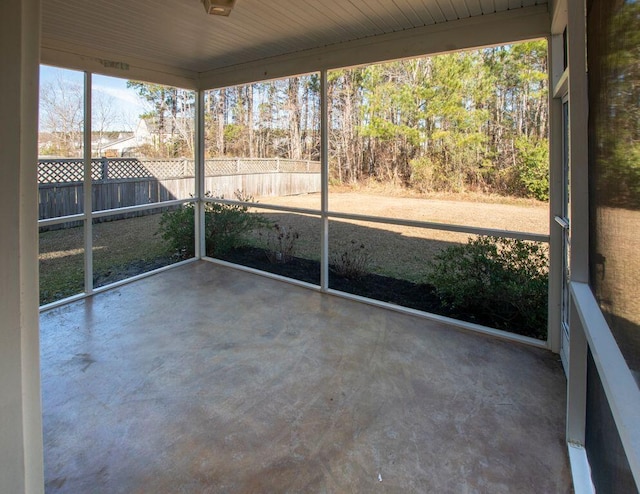 unfurnished sunroom featuring a wealth of natural light