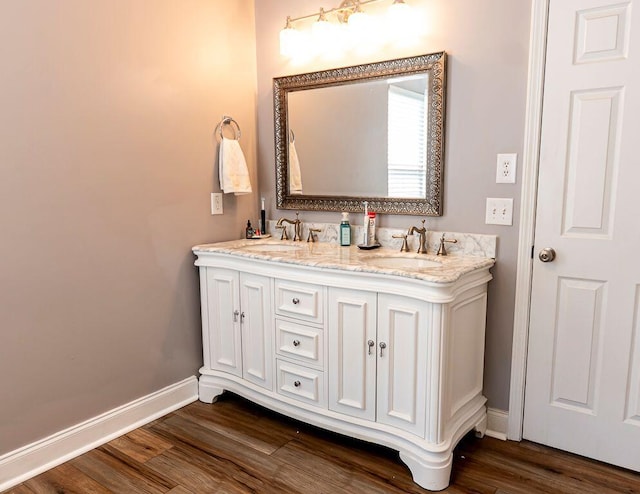 bathroom featuring vanity and hardwood / wood-style floors