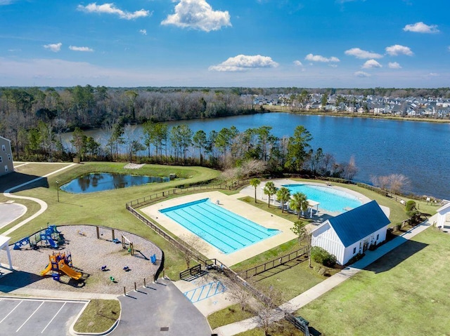 exterior space featuring a water view and a lawn