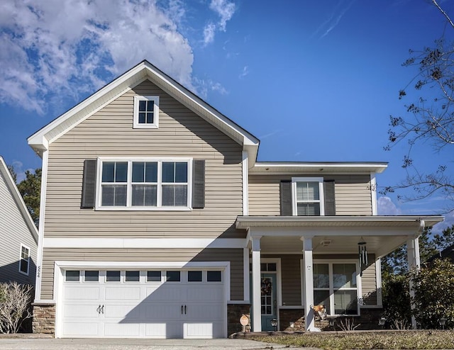 view of front facade with a garage and a porch