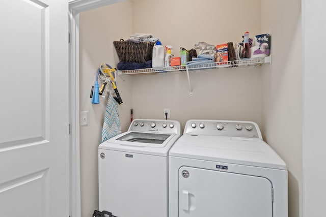 laundry area featuring washing machine and dryer and laundry area