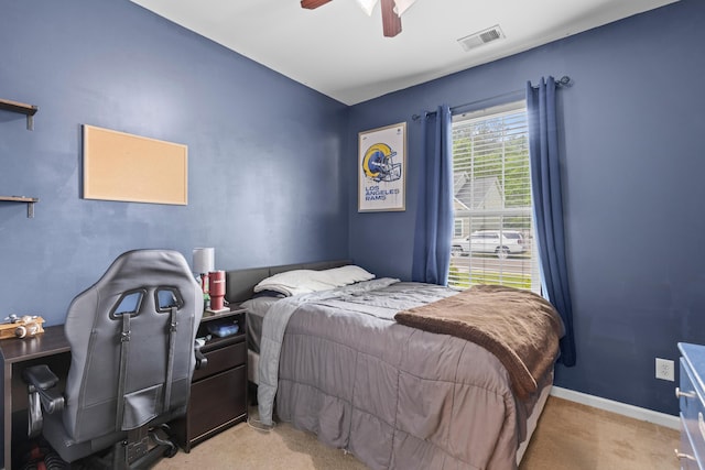 bedroom featuring carpet, visible vents, baseboards, and a ceiling fan