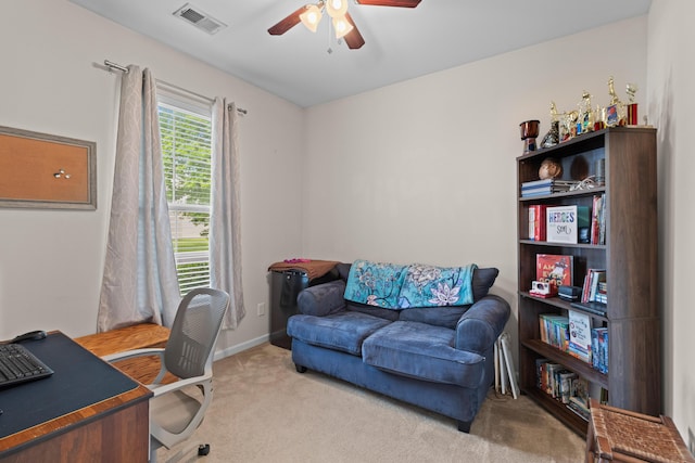 office area featuring carpet floors, ceiling fan, visible vents, and baseboards