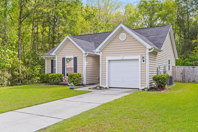 ranch-style house with a front yard, an attached garage, fence, and concrete driveway