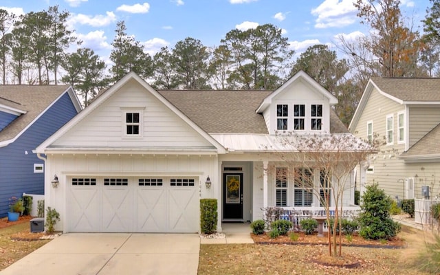 view of front facade with a porch and a garage