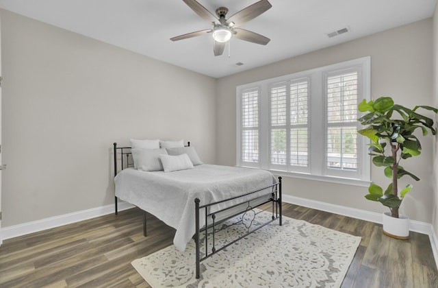 bedroom featuring dark hardwood / wood-style flooring and ceiling fan