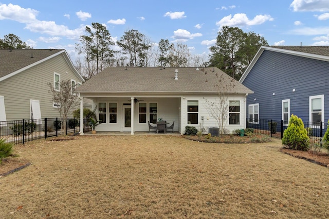 back of property featuring a yard, a patio, and ceiling fan