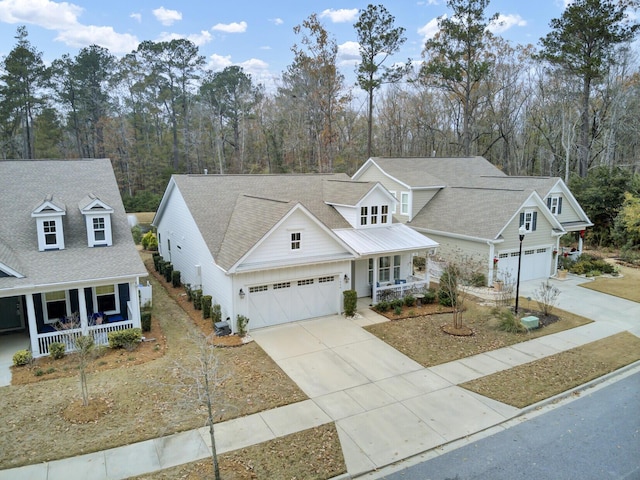 view of front facade featuring a porch and a garage