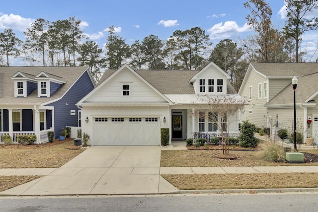 view of front facade with a porch and a garage