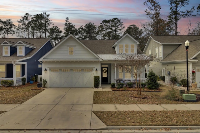 view of front of house with a porch and a garage