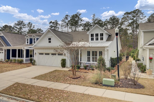 view of front of property featuring a porch and a garage