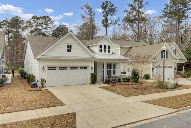 view of front of property with covered porch and a garage