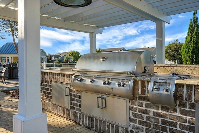 view of patio featuring a pergola and area for grilling