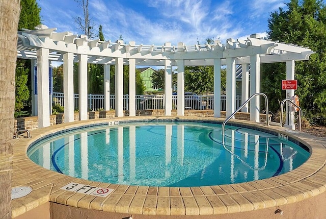 view of swimming pool with a pergola