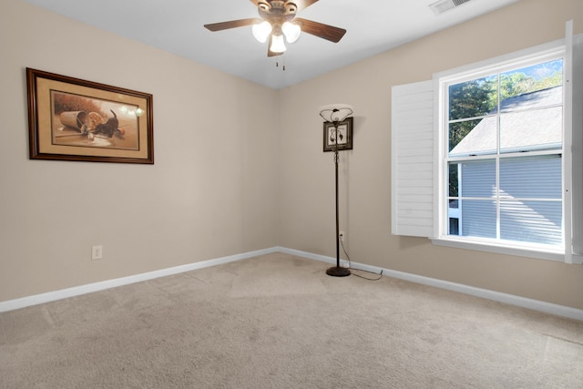 carpeted empty room with ceiling fan