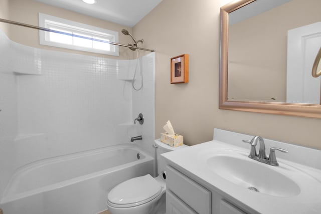 full bathroom with vanity, shower / bath combination, and toilet