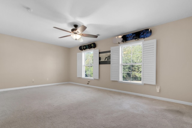 unfurnished room featuring carpet and ceiling fan