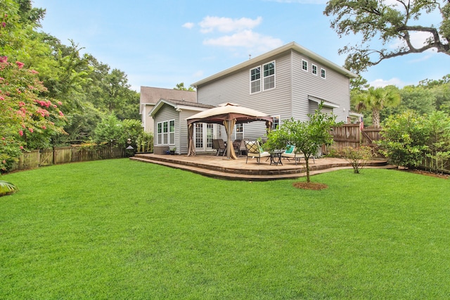 back of house with a gazebo, a patio area, and a lawn