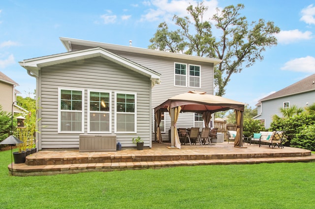 back of house with a gazebo, a patio area, and a lawn