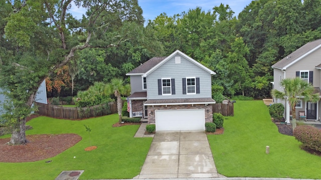 view of front facade featuring a front yard and a garage