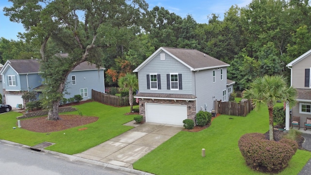 view of front of home with a front lawn and a garage