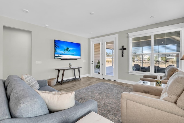 living room with french doors and hardwood / wood-style flooring