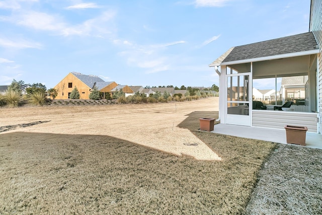 view of yard featuring a sunroom