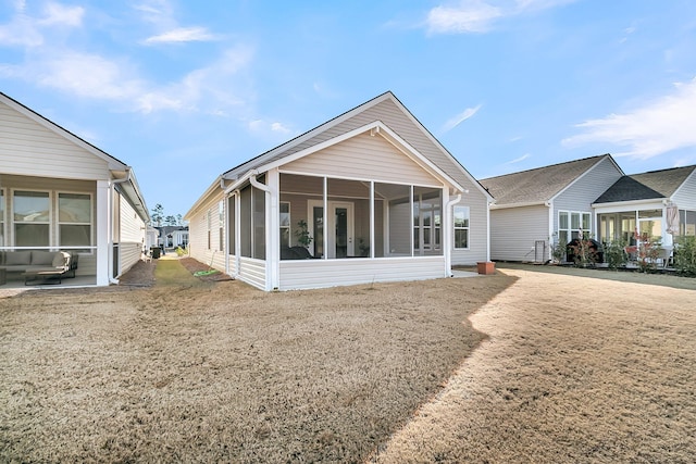 back of house with a sunroom