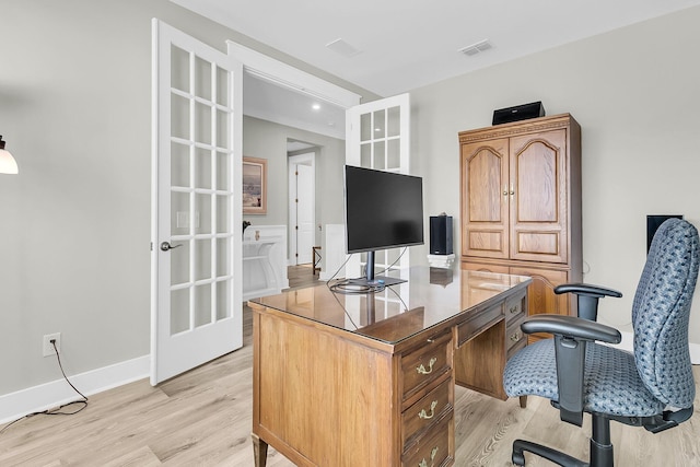 office area with french doors and light hardwood / wood-style flooring