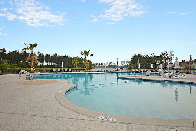 view of swimming pool featuring a patio