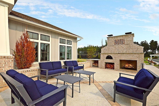 view of patio / terrace featuring an outdoor living space with a fireplace