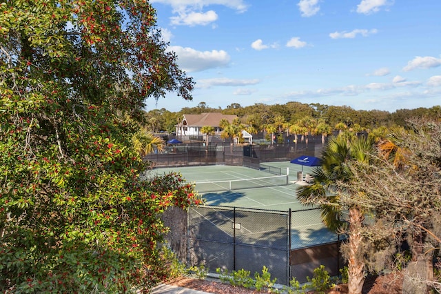 view of sport court featuring fence