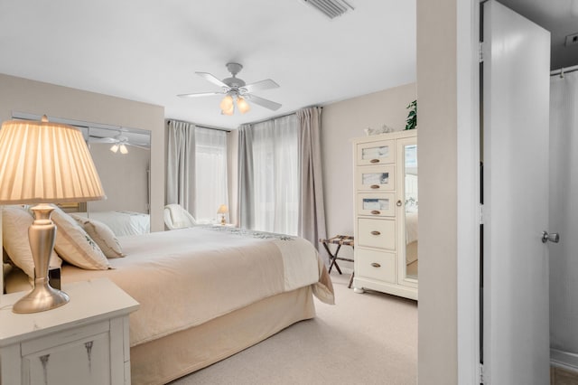 bedroom featuring visible vents, ceiling fan, and carpet flooring