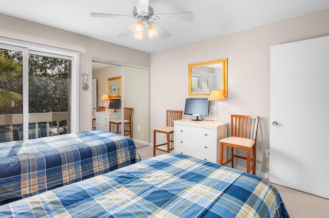 carpeted bedroom featuring a closet, baseboards, a ceiling fan, and access to outside