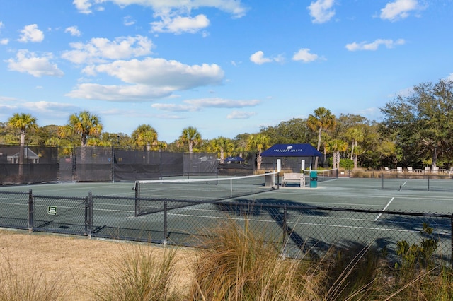 view of tennis court with fence