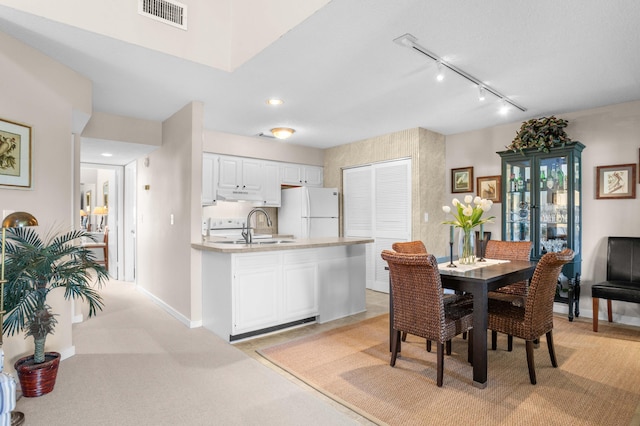 dining area featuring visible vents, track lighting, baseboards, light carpet, and recessed lighting