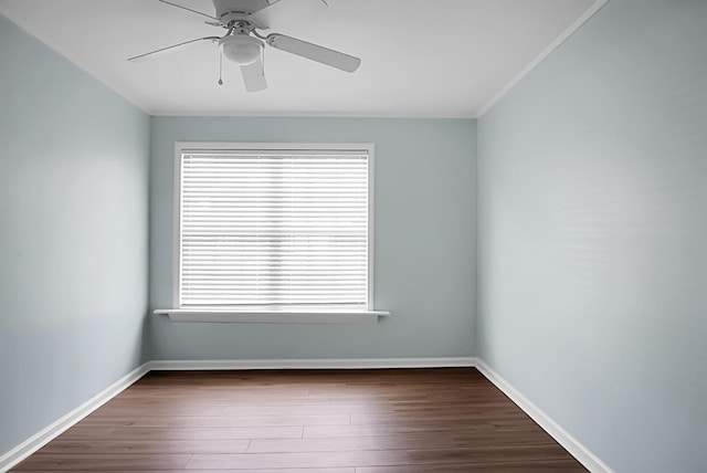 empty room with ceiling fan, baseboards, and dark wood-style flooring