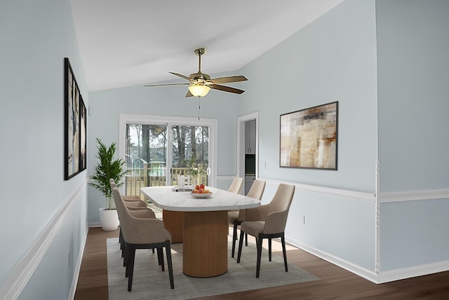 dining area with dark wood-style floors, lofted ceiling, a ceiling fan, and baseboards