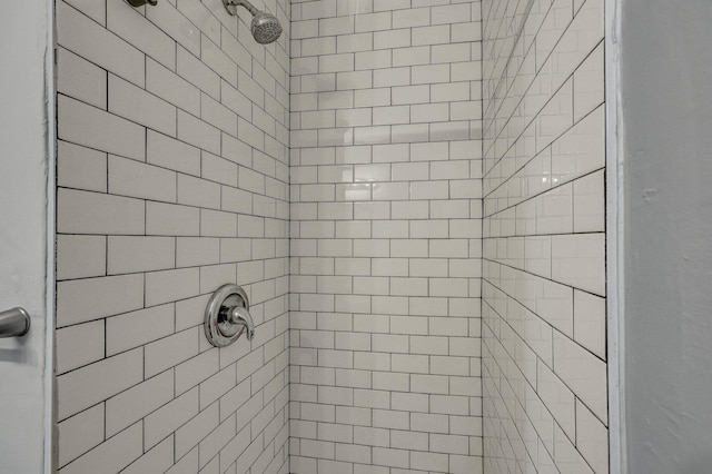 full bathroom with a tile shower