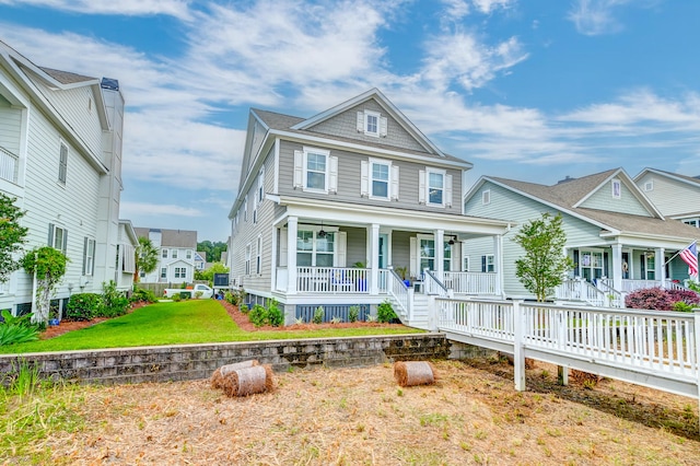 view of front facade featuring covered porch and a front yard