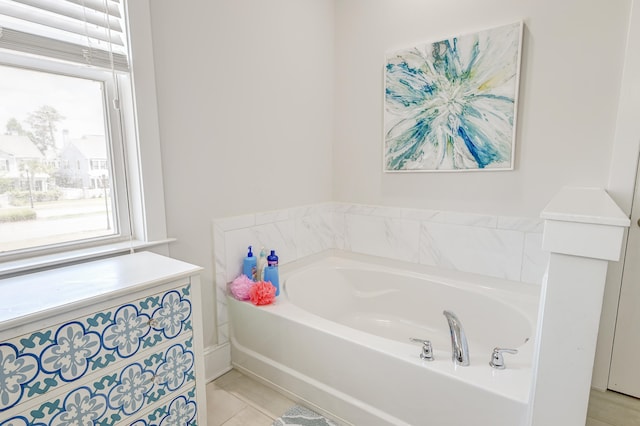 bathroom with tile floors and a bathing tub