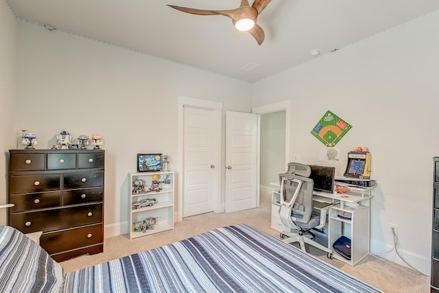 carpeted bedroom featuring ceiling fan