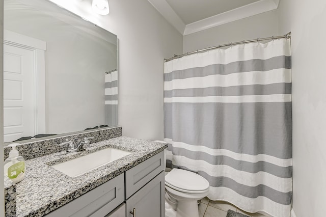 bathroom with tile flooring, oversized vanity, and toilet