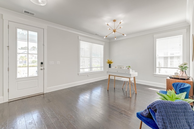 rec room with ornamental molding, a healthy amount of sunlight, and dark hardwood / wood-style floors