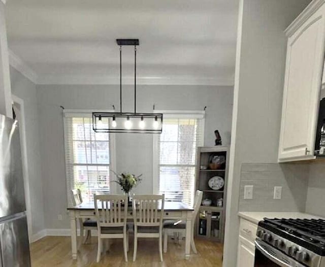 dining space featuring light hardwood / wood-style flooring