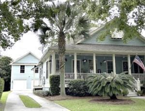 view of front of property with a porch and a garage