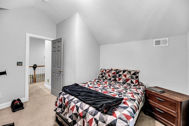 carpeted bedroom featuring lofted ceiling