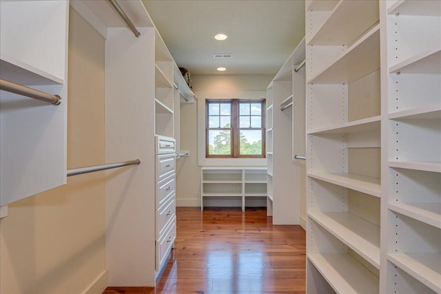 walk in closet featuring hardwood / wood-style floors