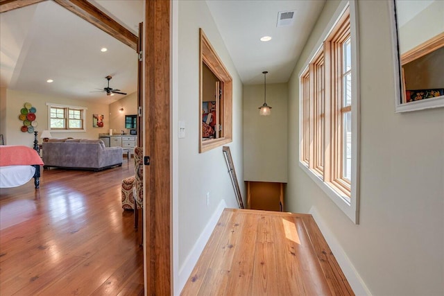 hall with hardwood / wood-style floors