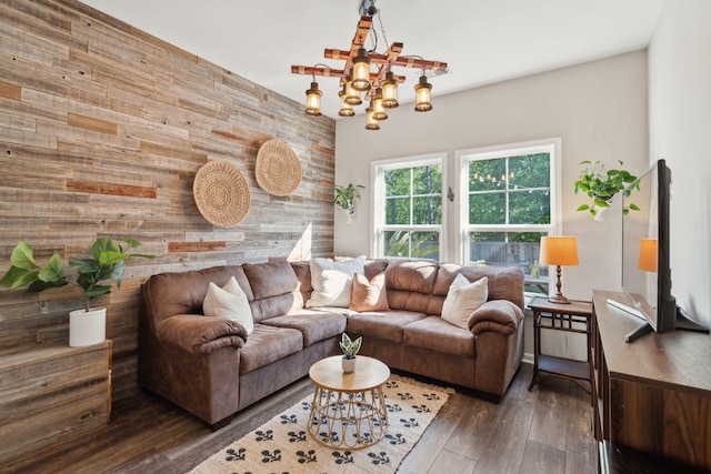 1606 Stovall Ct, Johns Island, SC 29455 - living area featuring wooden walls, an accent wall, hardwood / wood-style flooring, and a notable chandelier